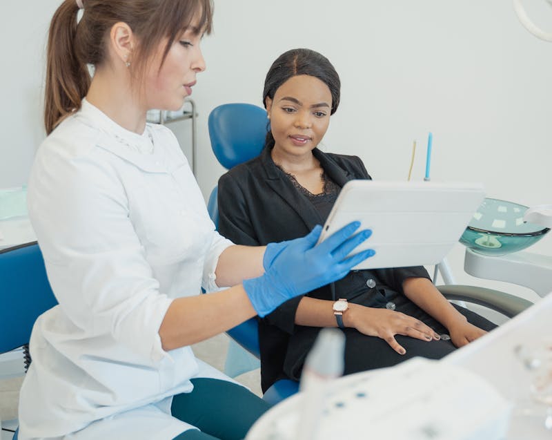 a dentist giving advice to a patient